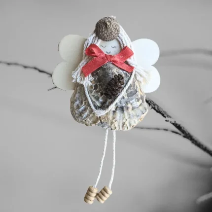Unique Charming Handmade Seashell Angel made of seashell, wooden wings and corn.