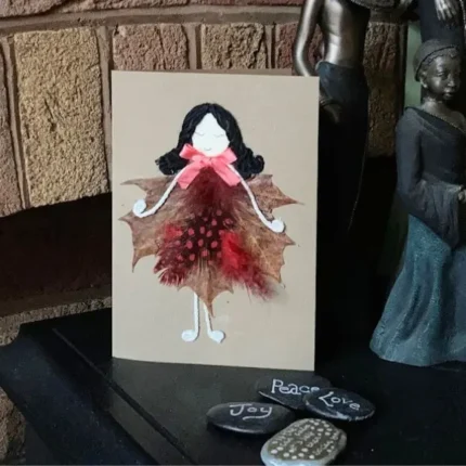 Handmade Luxury Birthday Card for Her. Nature presented on the fireplace The card is made out of leaves and feathers.