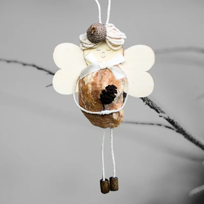 Perfect Handmade Shell Ornament - A Gift for The Seashell Lovers. Made of brownish seashell, wooden wings and corn.
